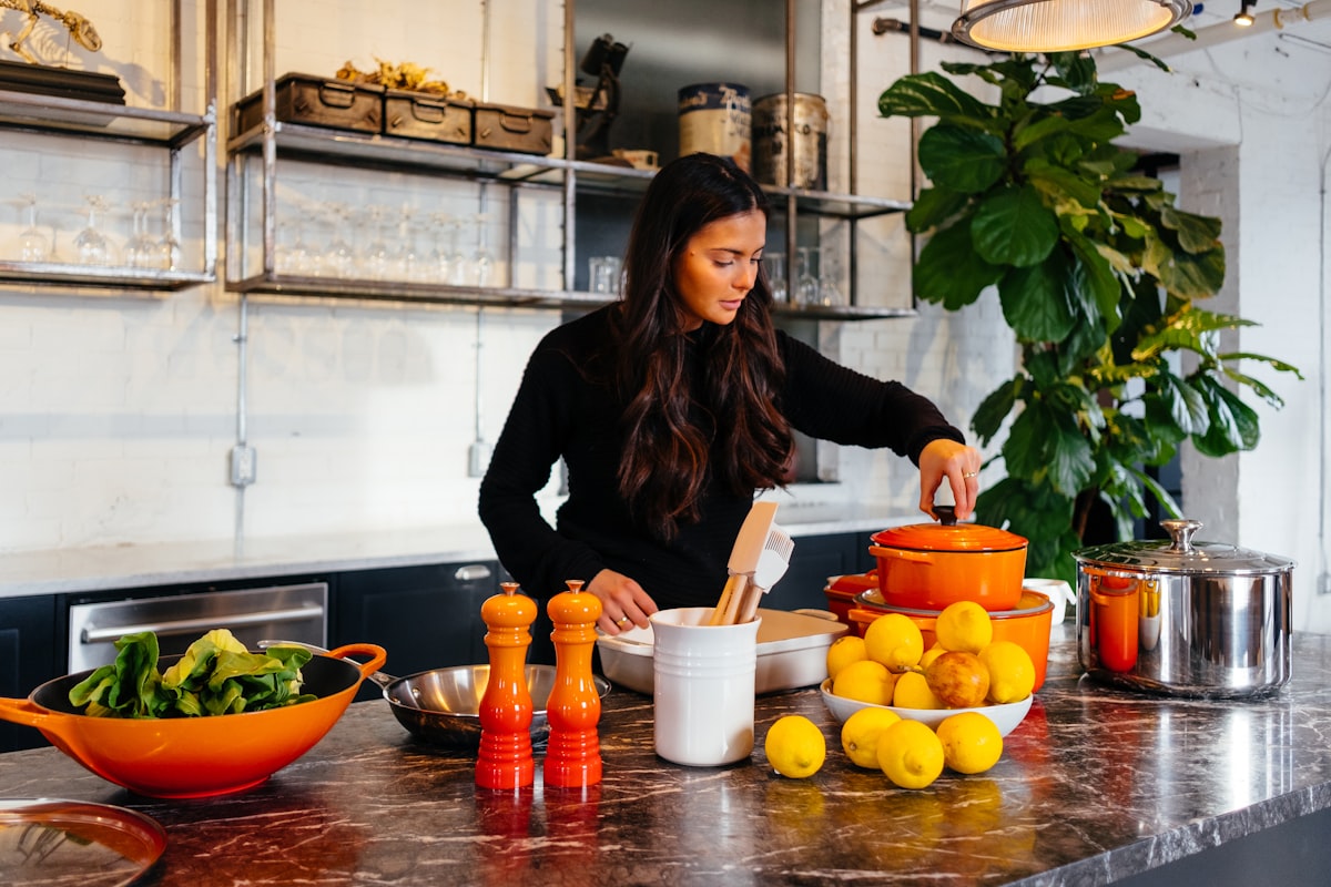 Healthy kitchen workspace with fresh ingredients and cookbooks